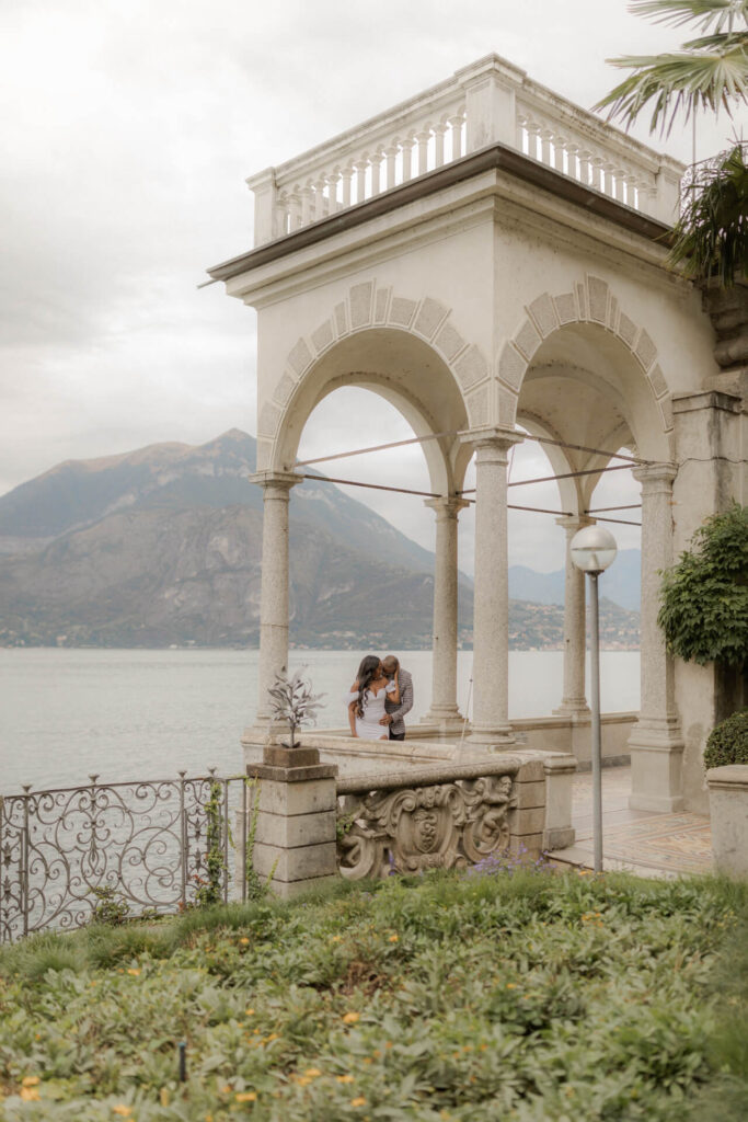 bride and groom kissing in the Loggia of Villa Monastero